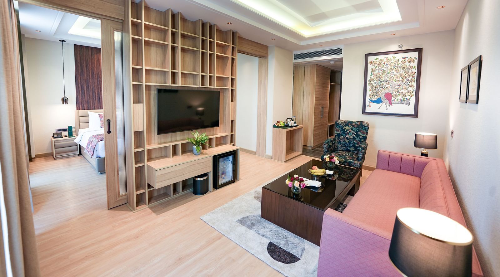 An image showcasing a living area of a suite with the bedroom seen in the back - NAMAMI BY ZENQ BANKHANDI
