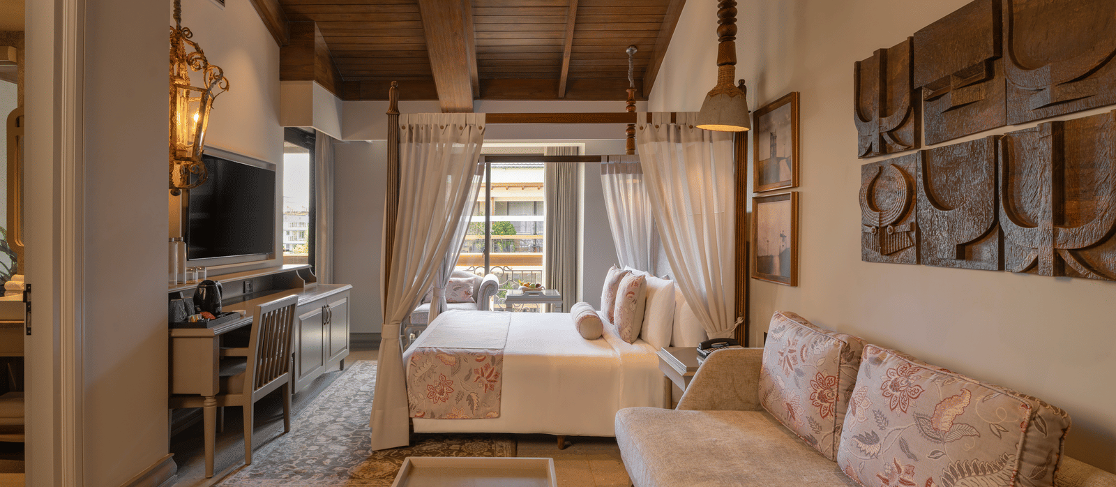 Side view of the Executive Room featuring a wooden ceiling and elegant furnishings at The Evren, Vagator.