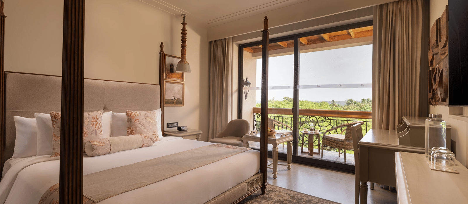 A corner-view shot of the Classic Room (Diwa) featuring a double bed along with a patterned rug placed in front of it at The Evren, Vagator.