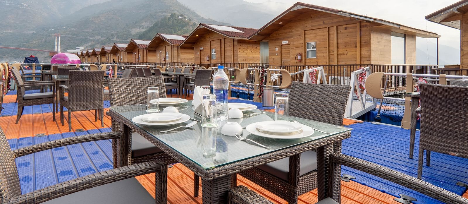 bedroom and dining area view at Floating Huts - Over the Lake captured during the day at Le ROI Floating Huts Eco Rooms5