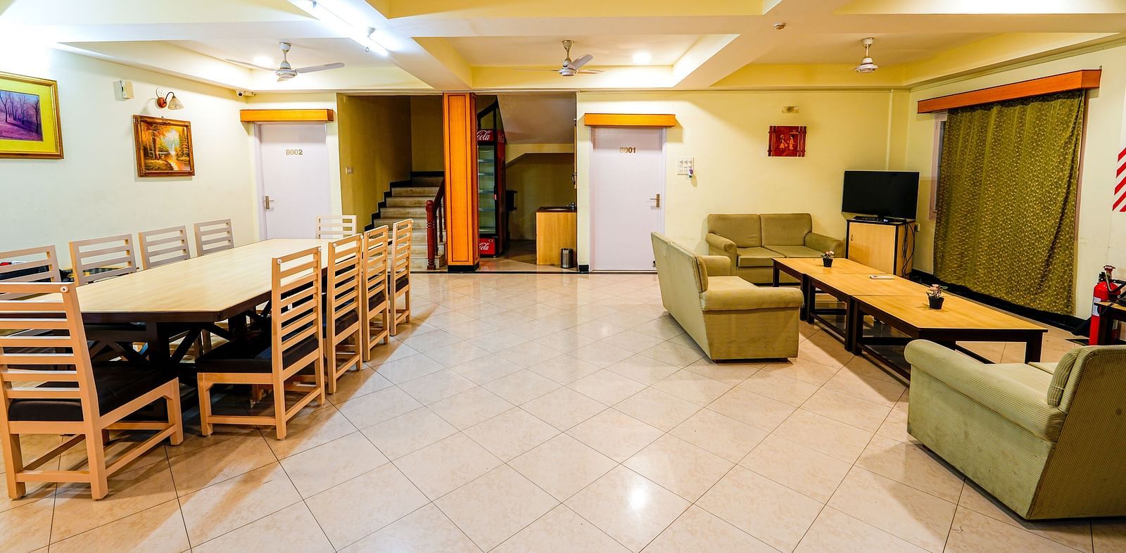 Room at Vasundhara Villa with sofa seating, a coffee table and a dining table