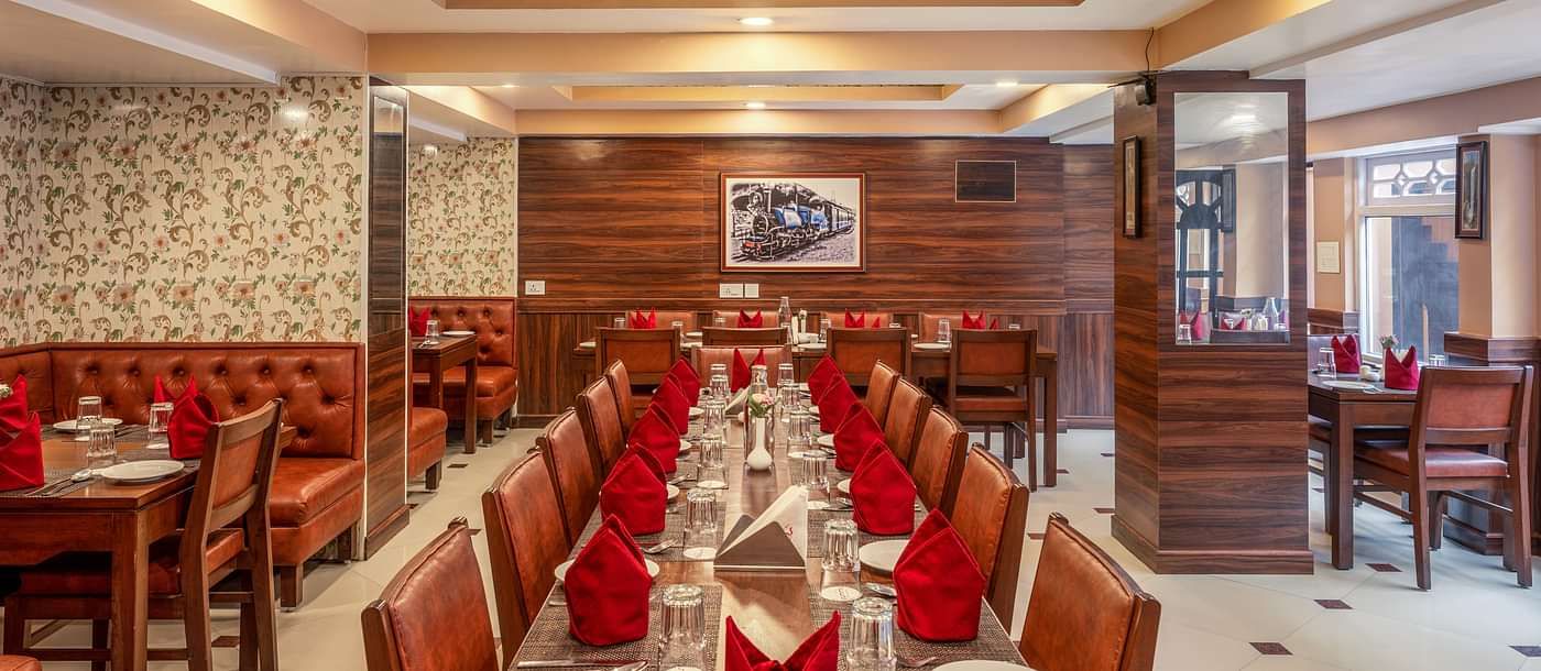 Multiple dining tables and chairs placed in a closed hall | Summit Oakden Resort & Spa, Mall Road