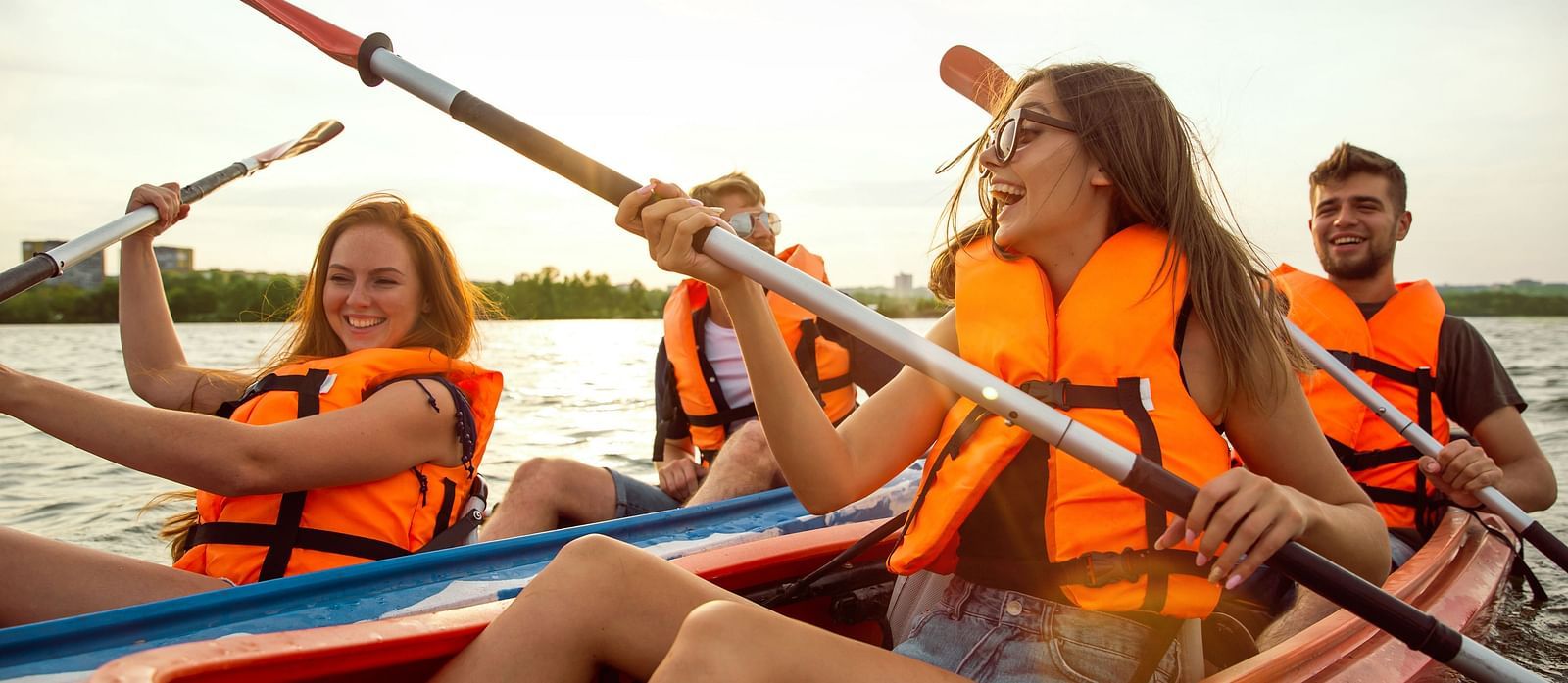 An image of four people boating in a river - Alibu Resort Nha Thrang