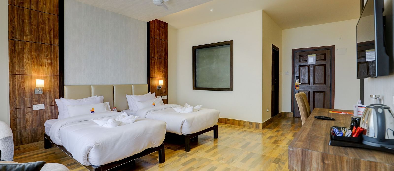 view of twin beds and TV of a Premium Room at Banari Regency by Summit, Namchi