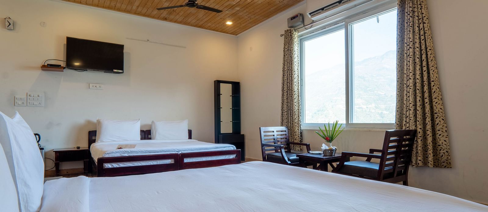 Family Room On Land closeup view of posh bedding and white duvet - Le ROI Floating Huts Eco Rooms3