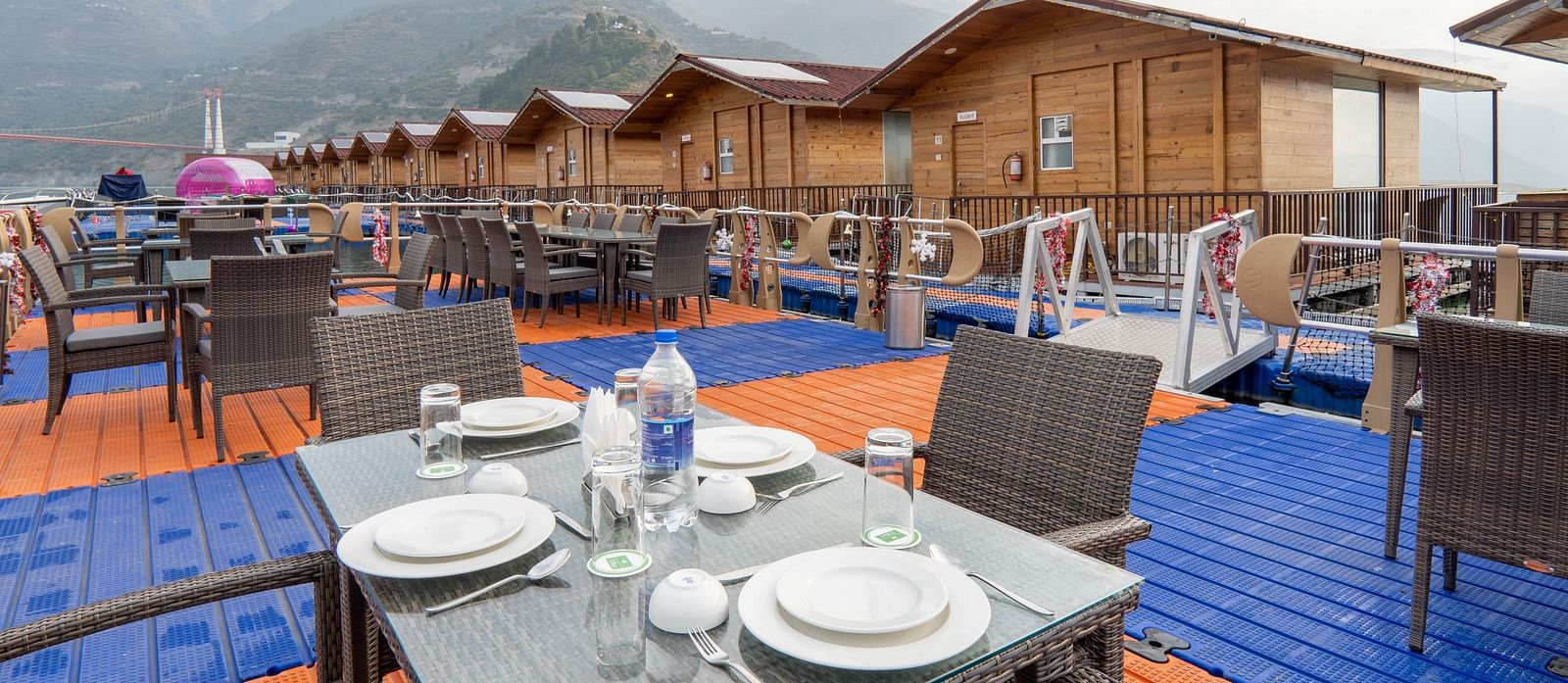 bedroom and dining area view at Floating Huts - Over the Lake captured during the day at Le ROI Floating Huts Eco Rooms1