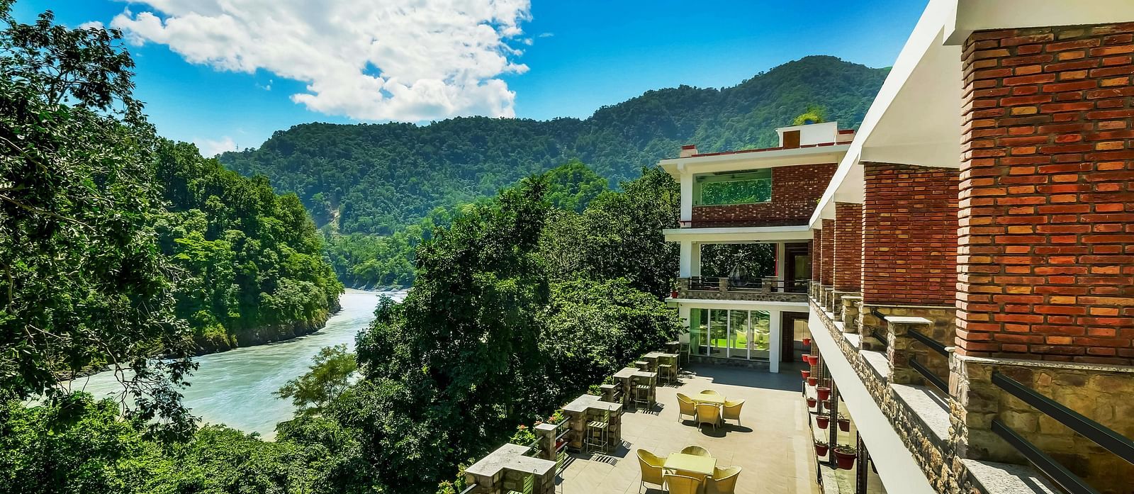 Facade of Summit By The Ganges Beach Resort & Spa, Rishikesh with view of the lush greenery at Summit By The Ganges Beach Resort & Spa, Rishikesh
