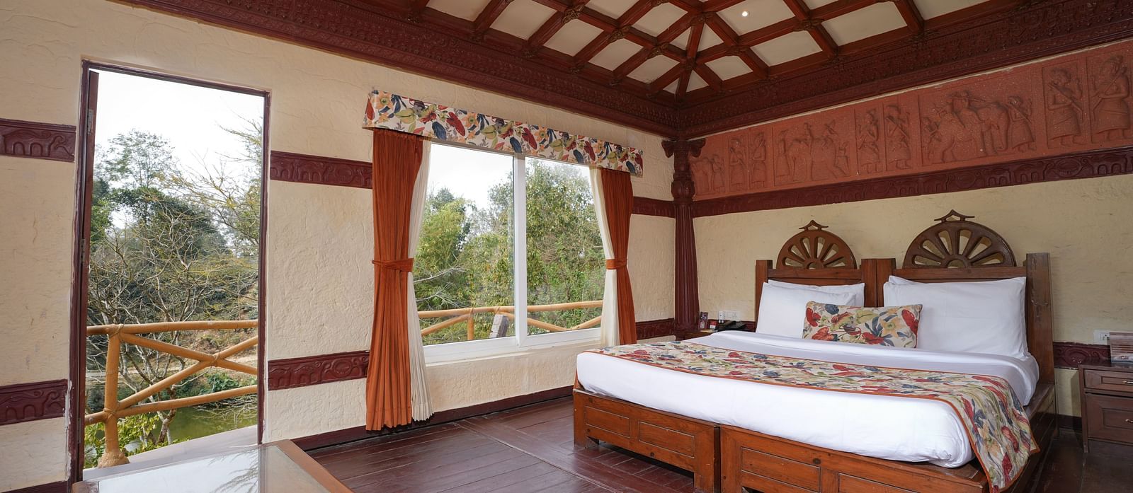 Ethnic villa offering a spacious bedroom and large windows with curtains at Summit Green Lake Tea Resort & Spa, Kaziranga