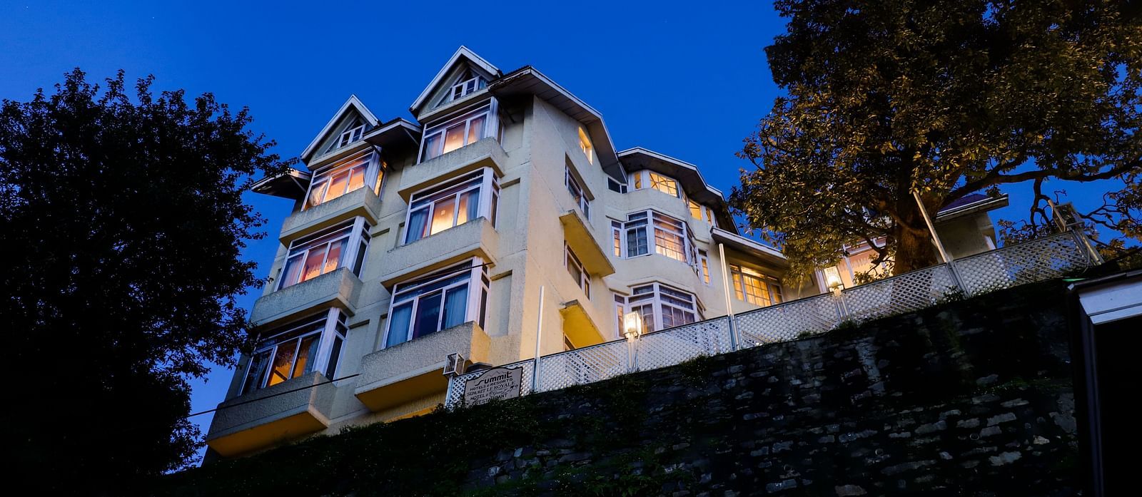 Nighttime exterior view of Summit Le Royale Hotel, Shimla