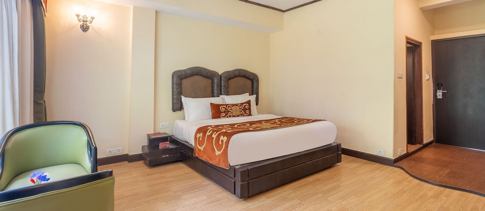king size bed  of deluxe bed at Summit Lillium Hotel & Spa, Kalimpong