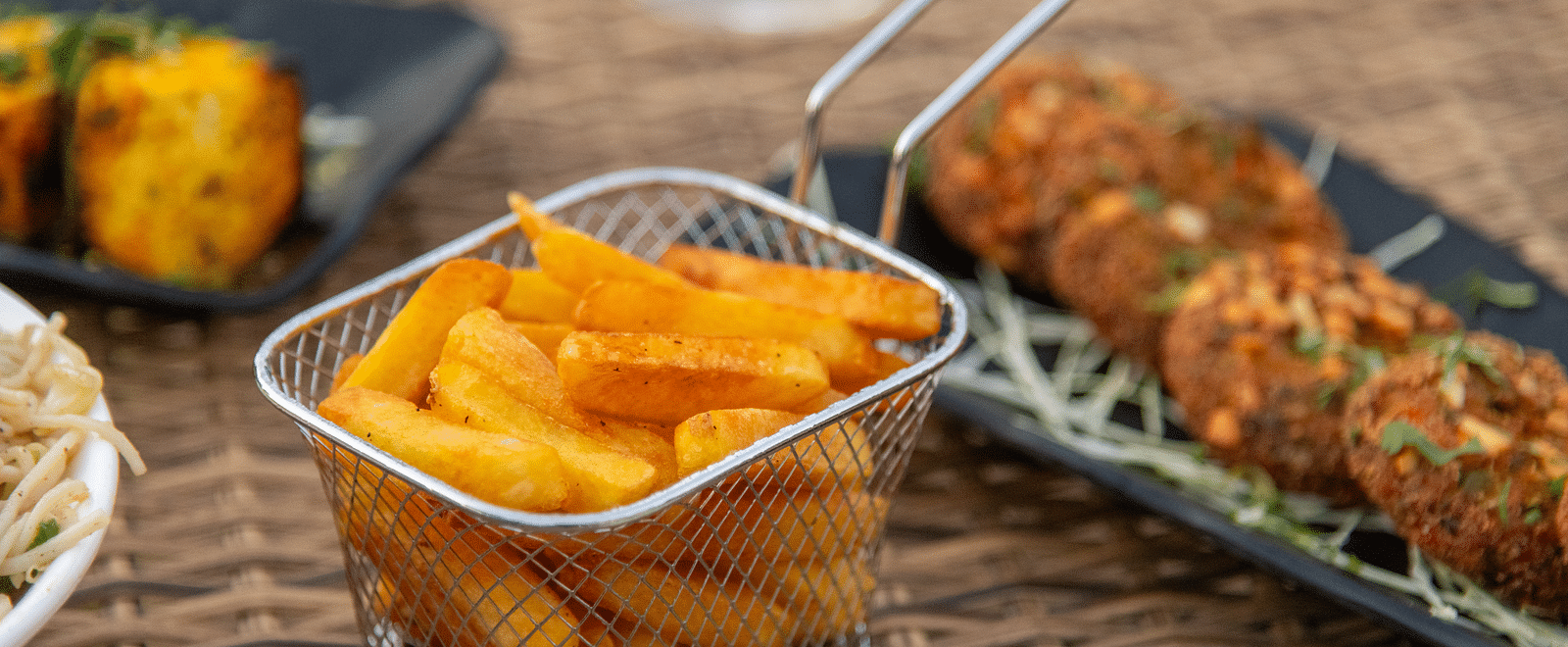 A plate of French fries served alongside other appetisers at DLS Park Grace, Haridwar.