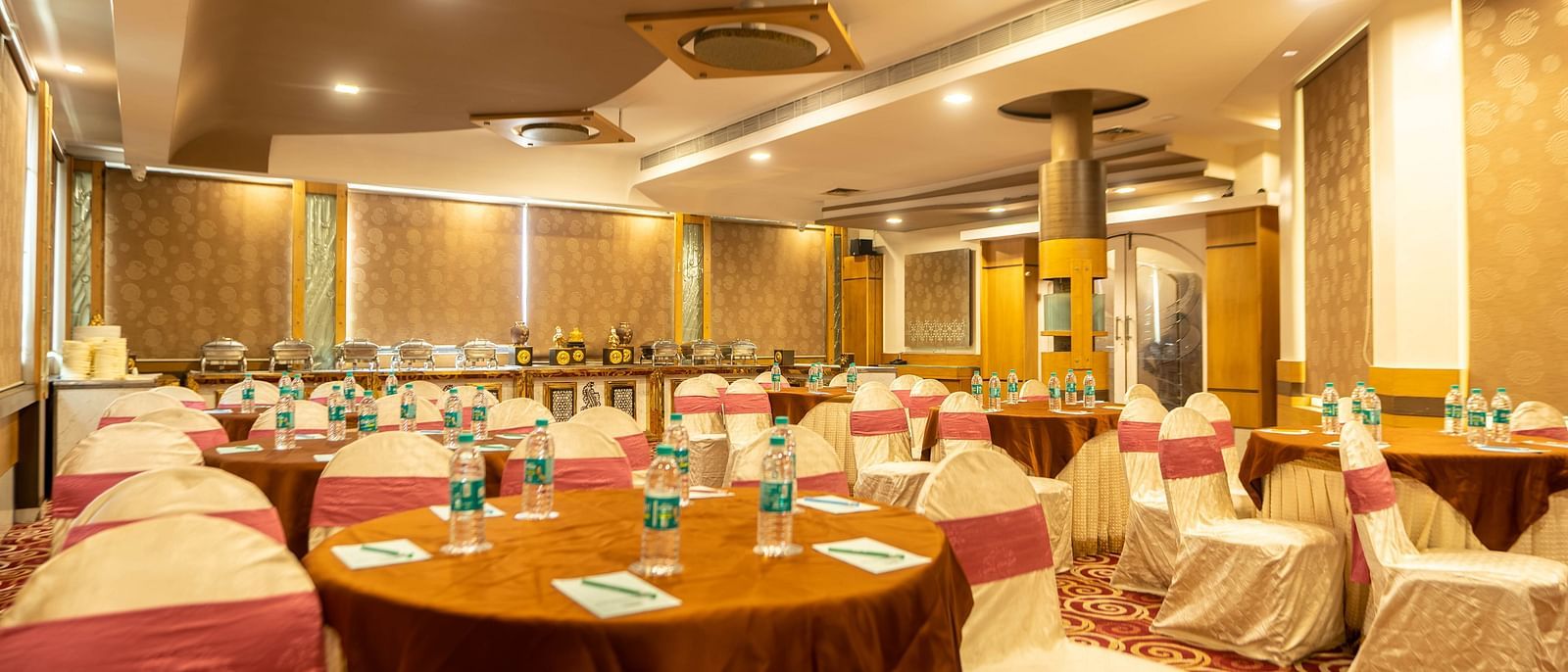 A banquet hall at Hotel Pai Viceroy Jayanagar in a wedding setup featuring ambient lighting