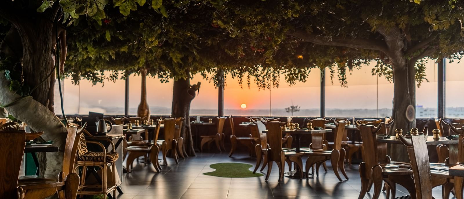 An image of a forest themed Jungle Restaurant at The President Hotel, Hubli