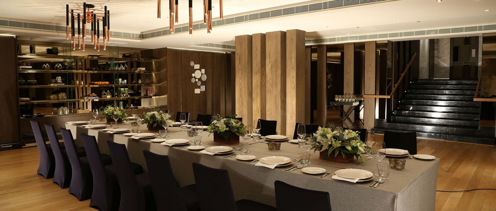 A sophisticated dining space with modern decor, offering a premium experience at The Raintree, St. Mary's Road.