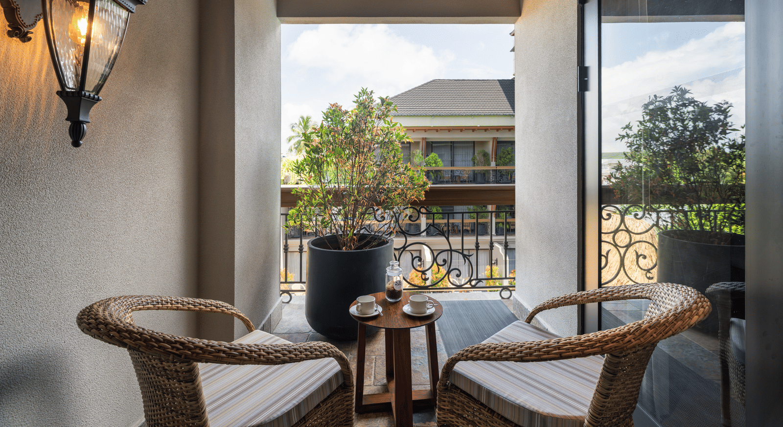 2 arm chairs kept on the balcony of the Executive Room along with a small coffee table at The Evren, Vagator.