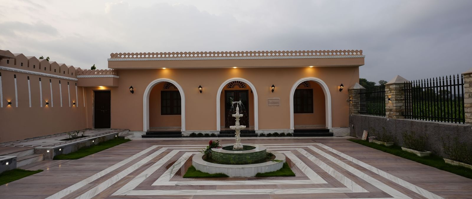 An eye-level, straight-on shot of the entrance to a building with a large courtyard at Mahendra Niwas.