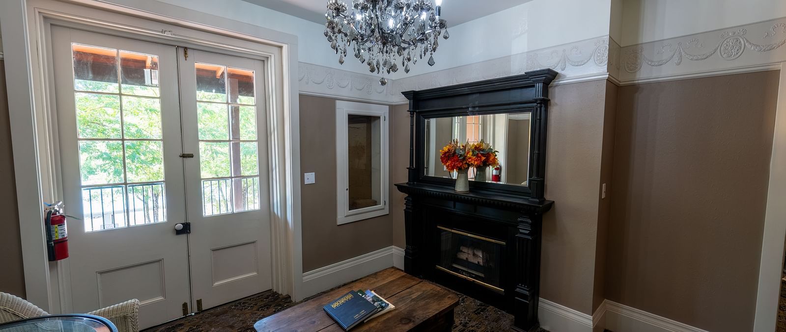 Elegant guest room with classic furnishings and natural light at The Groveland Hotel.