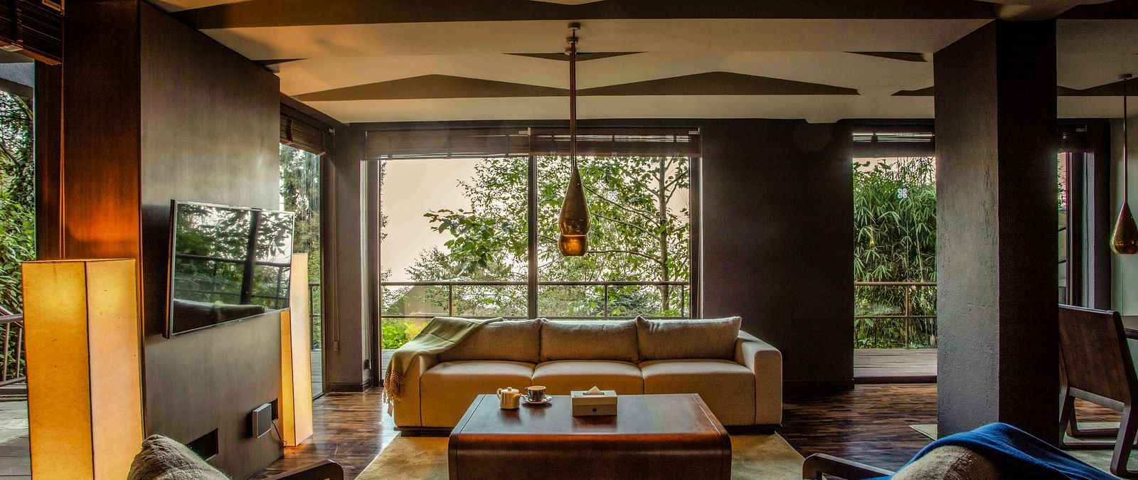 Natural light flooding a living room which has a couch and a centre table | Kavya Resort and Spa, Nagarkot