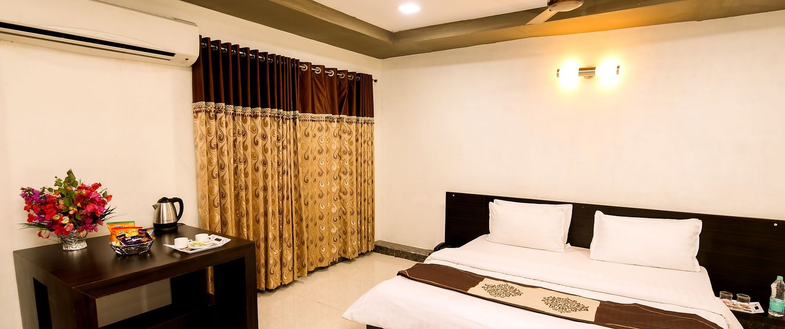 A room with with a double bed and work desk at Saavaj Resort