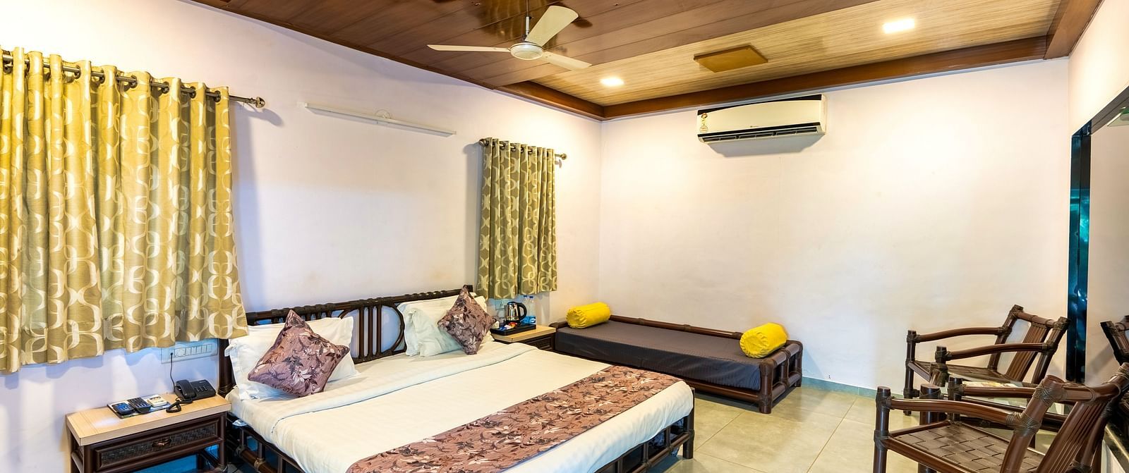A room with with a double bed and seating arrangement at Saavaj Resort
