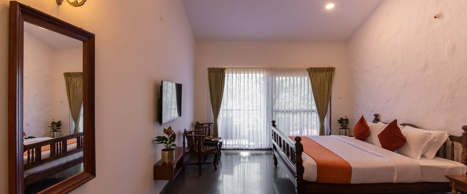 room with bed and large mirror - Tapovana, Sakleshpura