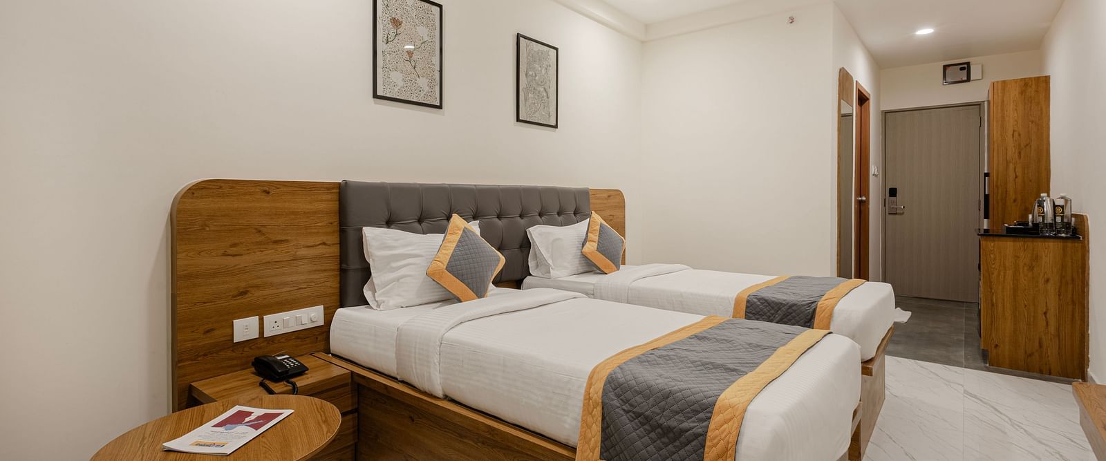 Corner angle of the twin bedroom with light and contemporary design at Lemonridge Hotels, IDPL Balanagar