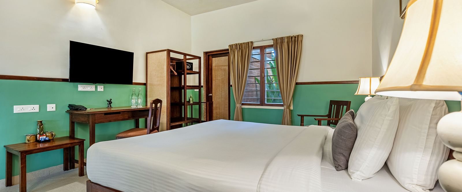 Spacious and modern hotel room near Pondicherry with a king size bed and work desk | Mango Hill Shallow Beach Resort ECR.