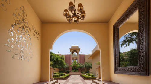 Side benches and a luxurious mirror of porch in a hotel in manesar