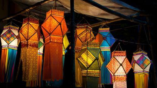 Colorful lanterns hanging in a night market.