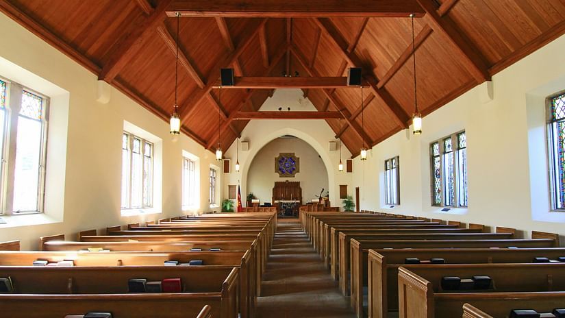 The interior view of inside a church with the altar in view