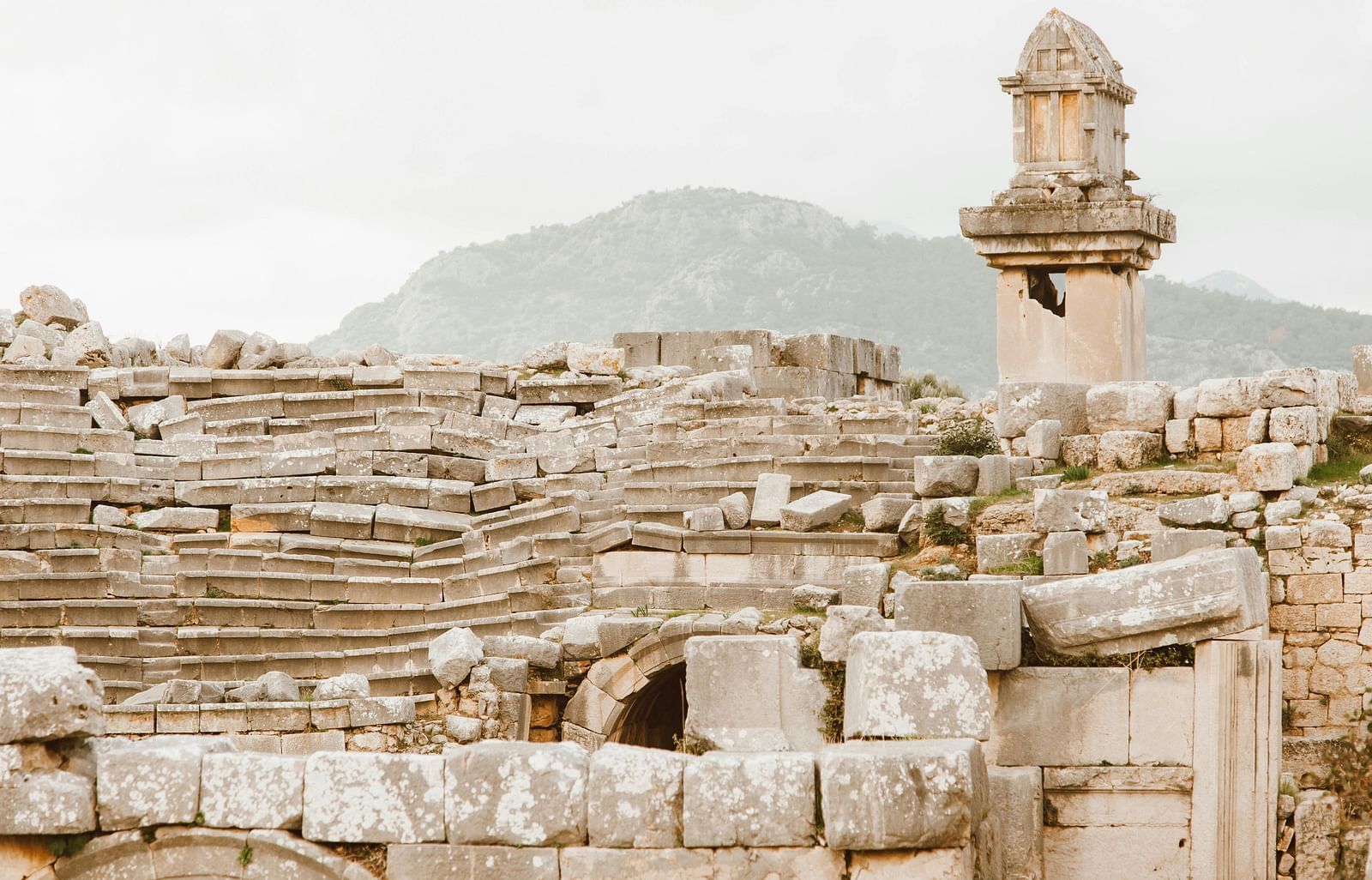A picture of a  historical monument with ancient stone structures and intricate carvings.
