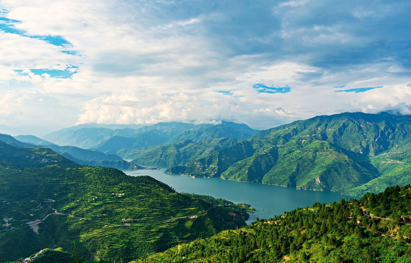Picture featuring panoramic view of a Lake and mountains.