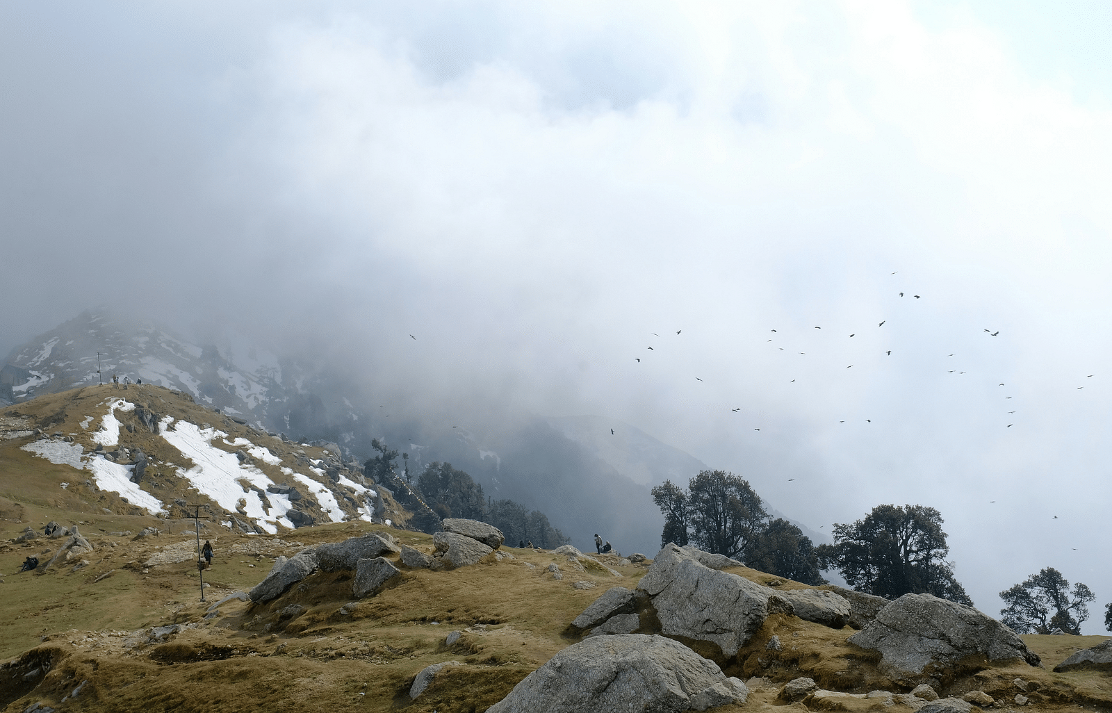 An image of the Dharamkot Village with mountains in a foggy weather