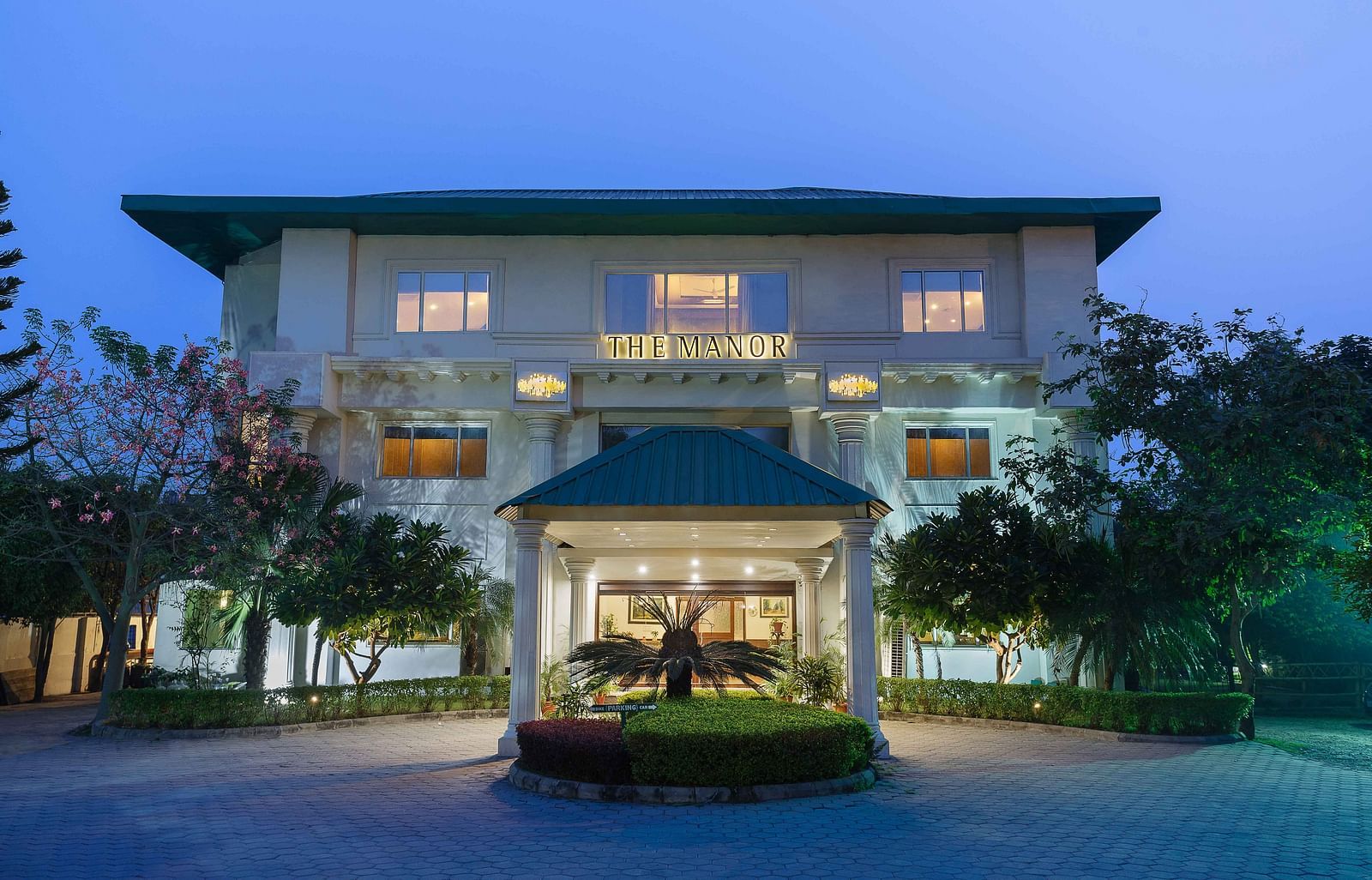 A wide view of the facade of the hotel taken from the front - The Manor, Kashipur