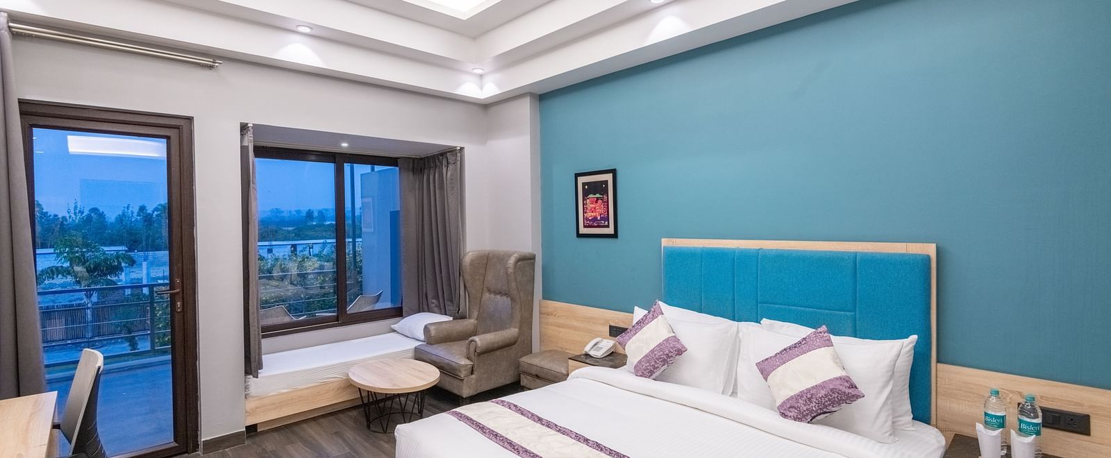 Spacious guest room with large windows and outdoor views - DLS Forest Vines Resort & Spa, Ramnagar (Jim Corbett)