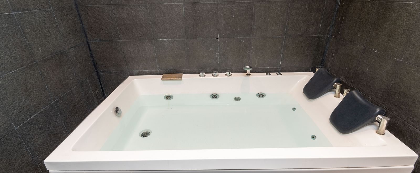 Indoor jacuzzi bathtub setup in a tiled bathroom - DLS Forest Vines Resort & Spa, Ramnagar (Jim Corbett)