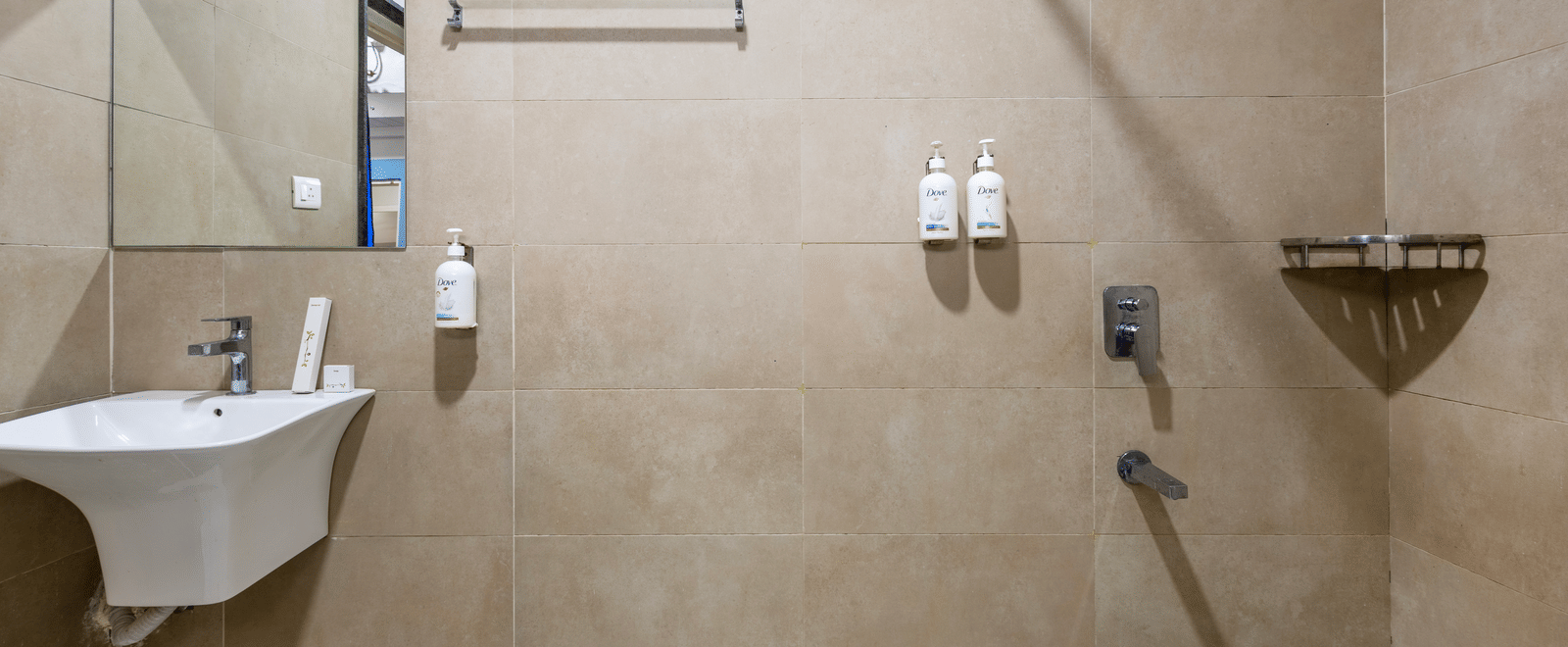 Bathroom of the 4BHK of Kove Smart Stays, furnished with bathroom and shower fittings.