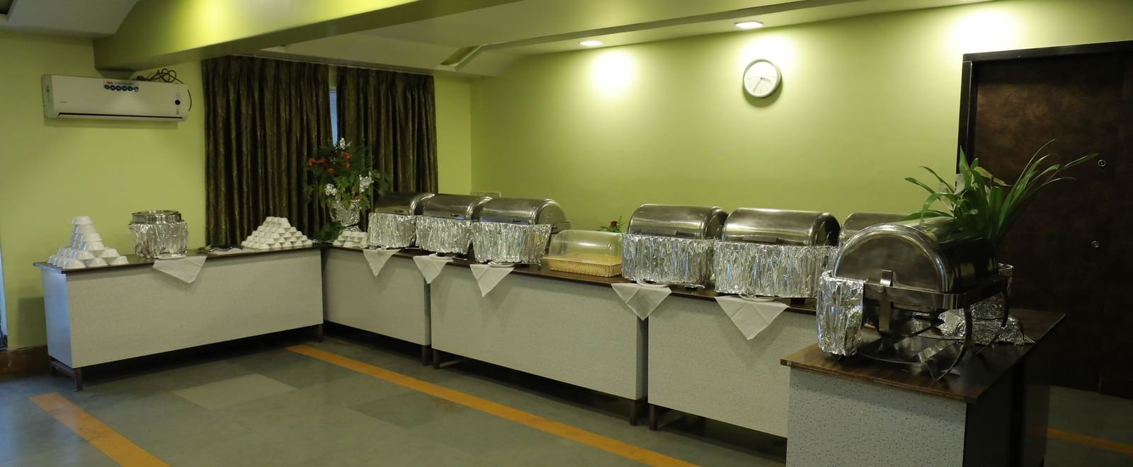 Buffet section at Krushnai Resort with multiple chafing dishes and a countertop.