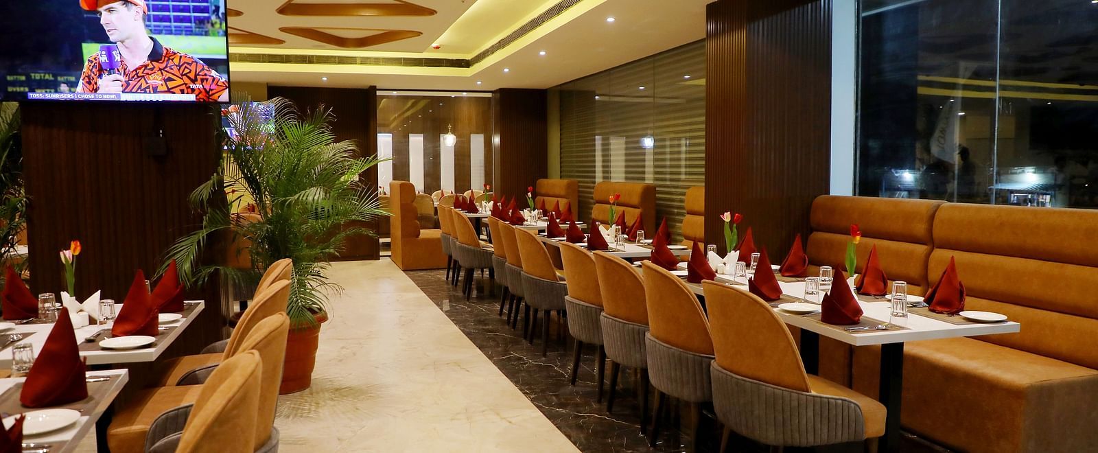 Spacious restaurant at Town Square Suites with modern interiors and ample seating arrangement