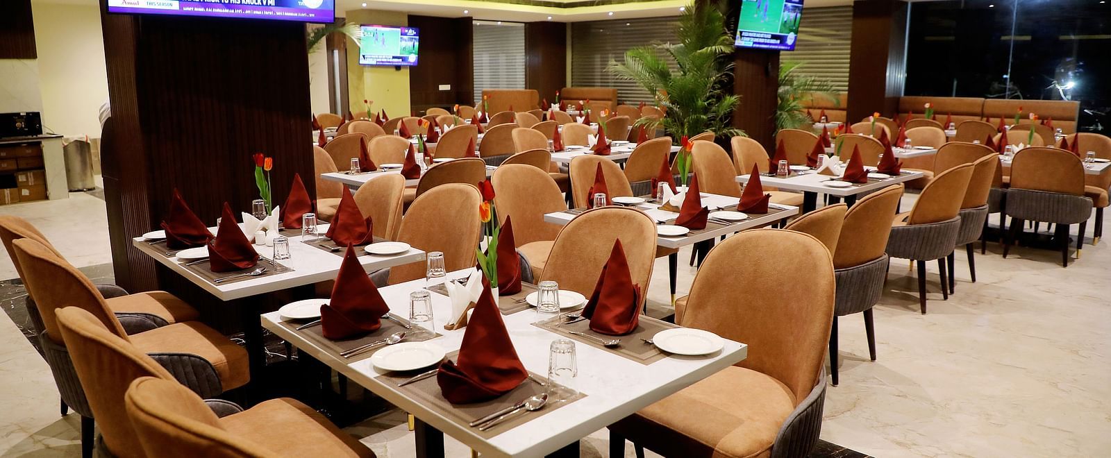 Elegant dining area at Town Square Suites restaurant with stylish seating and fine table settings
