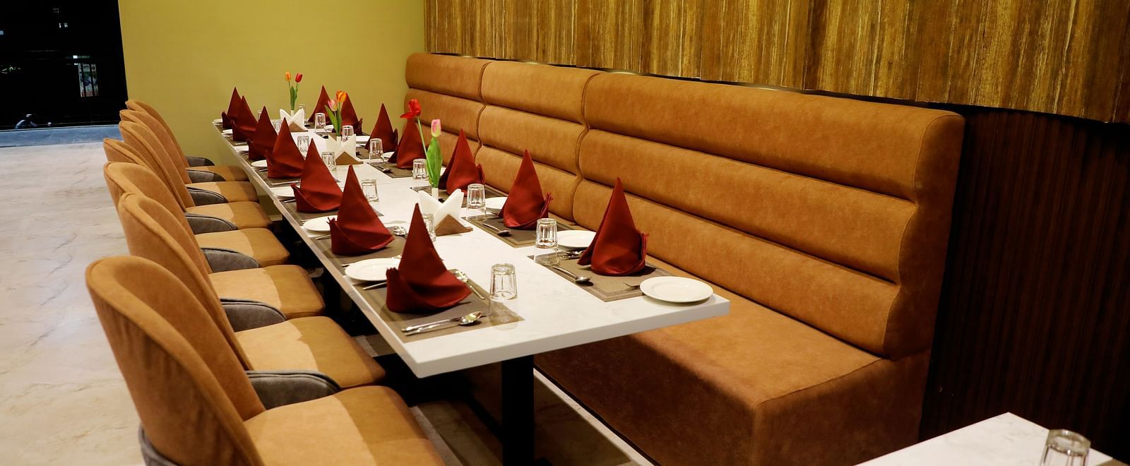 Private dining booths at Town Square Suites restaurant with intimate seating and elegant decor