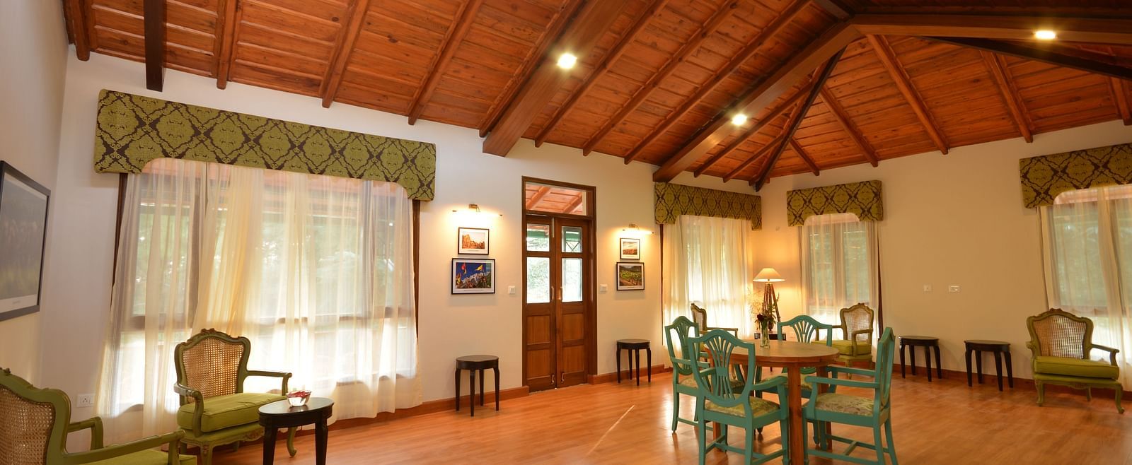 A spacious conference room in Almora with elegant wooden interiors and comfortable seating - BluSalzz Escapade - Anant Rasa Resort
