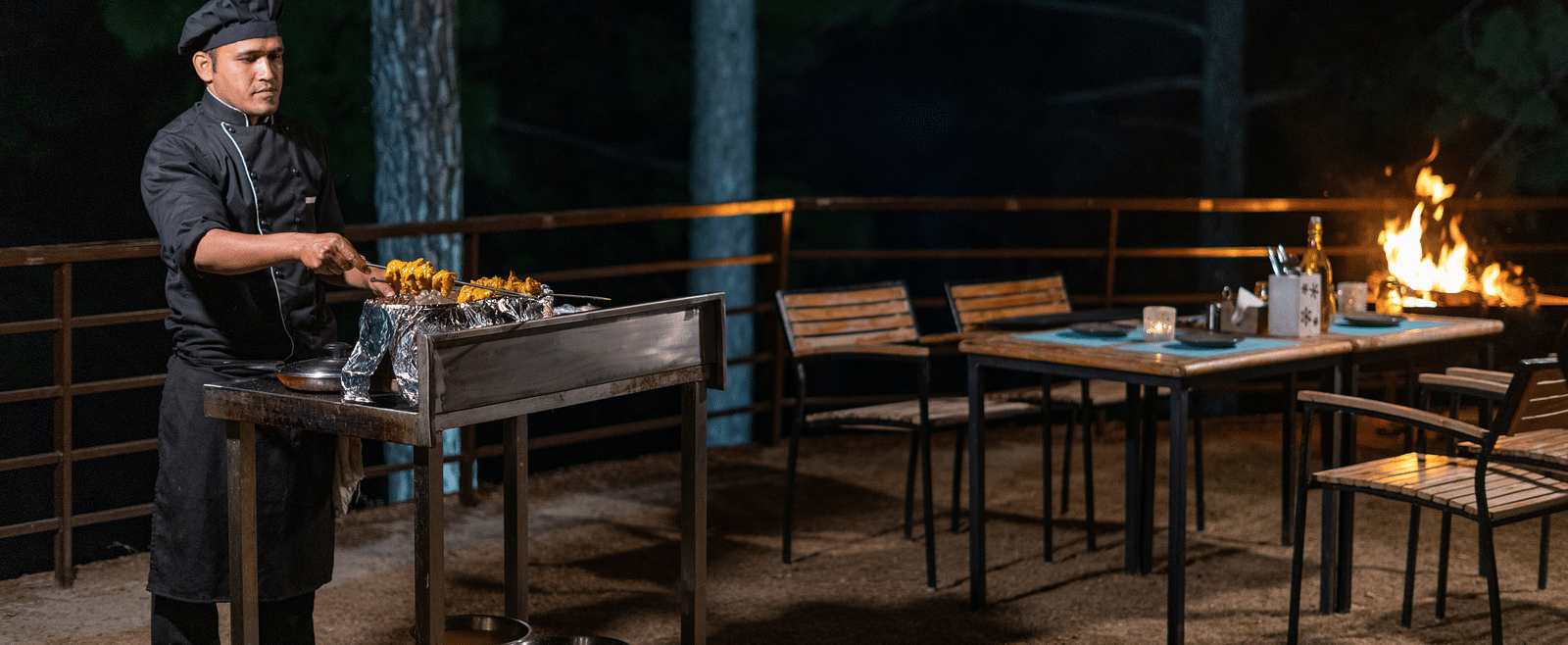 Chef performing a live barbecue session in the garden at BluSalzz Escapade Resort, Lansdowne.