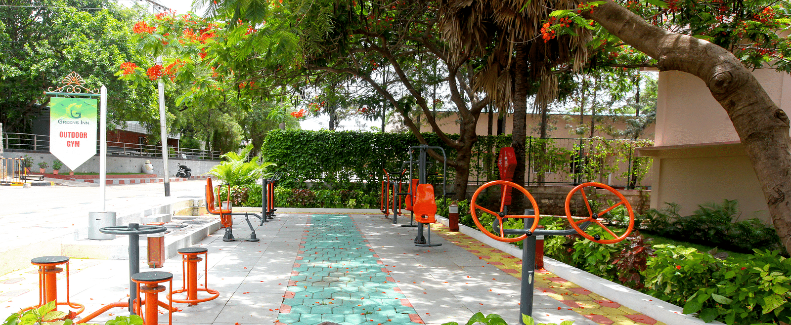 Outdoor games placed under trees at Greens Inn - Fun Activities in Hyderabad.