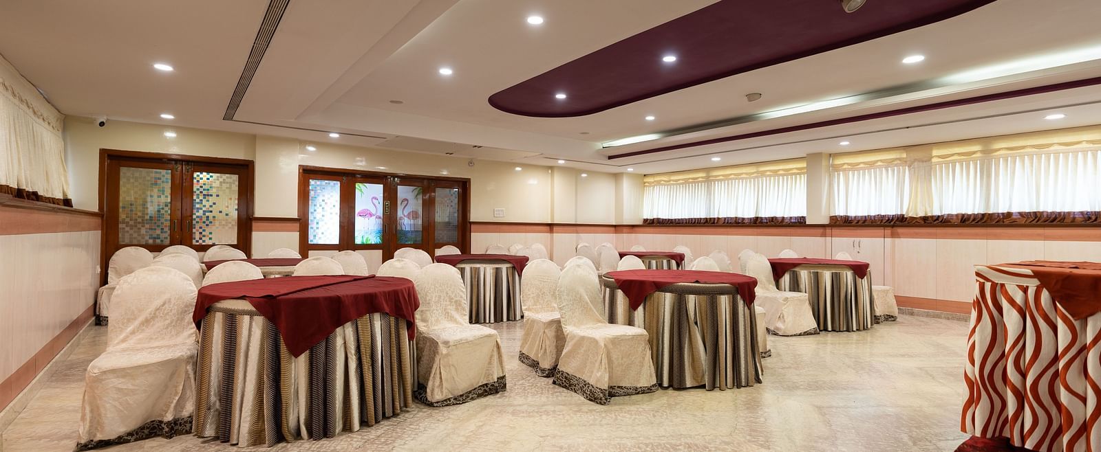 Seating arrangements inside the banquet hall - Hotel Pai Comforts, JP Nagar