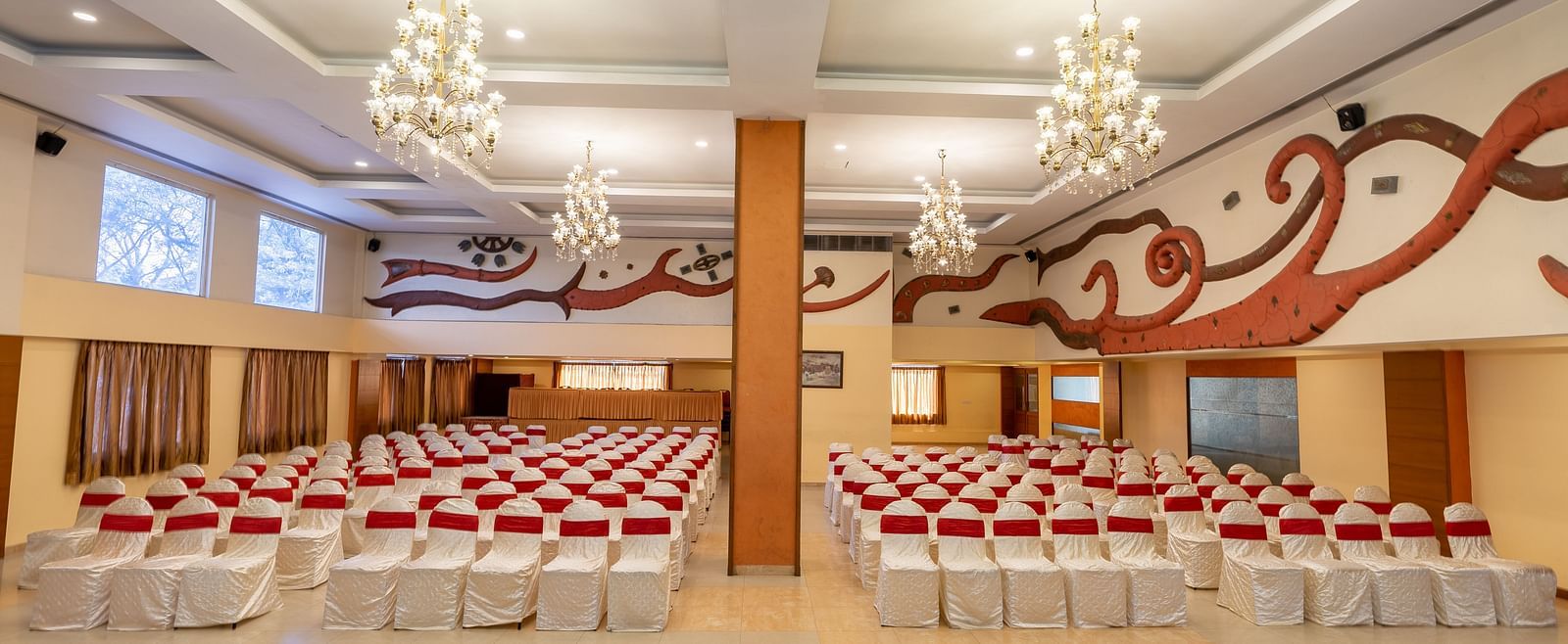 Theatre style seating arrangements inside the a banquet hall at Hotel Pai Vista, Mysore set up for an event