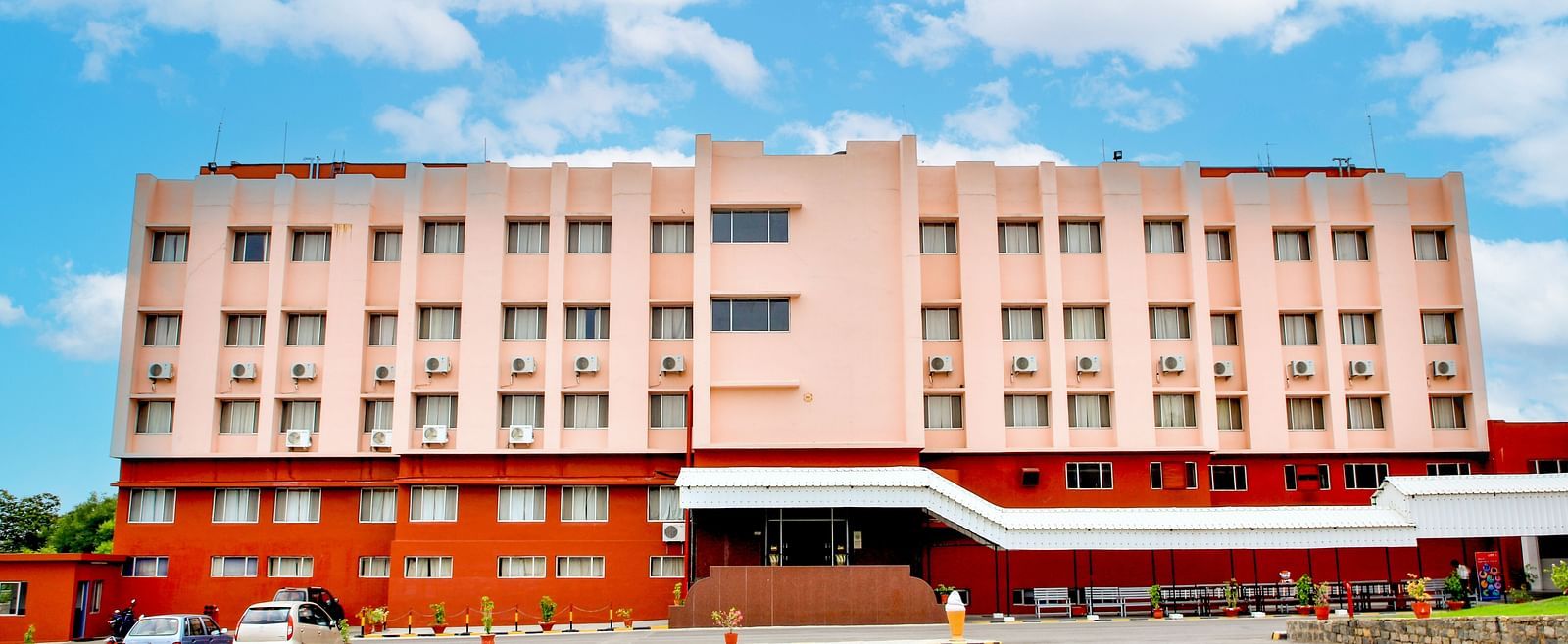 A long shot of the facade of Hotel Sahara in Ramoji Film City - Scenic Hotel Exterior in Hyderabad.