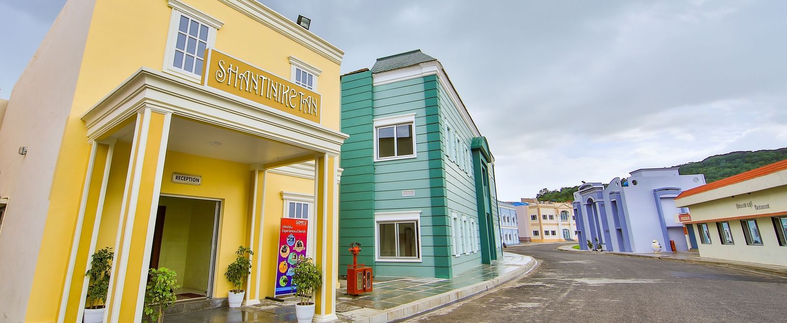 Facade of Hotel Shantiniketan in Hyderabad on a cloudy day near Ramoji Film City.
