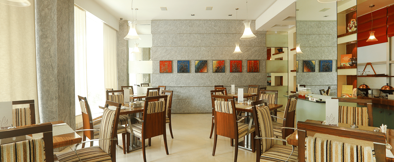 Dining setting of a restaurant at Regency Hotel, Mumbai.
