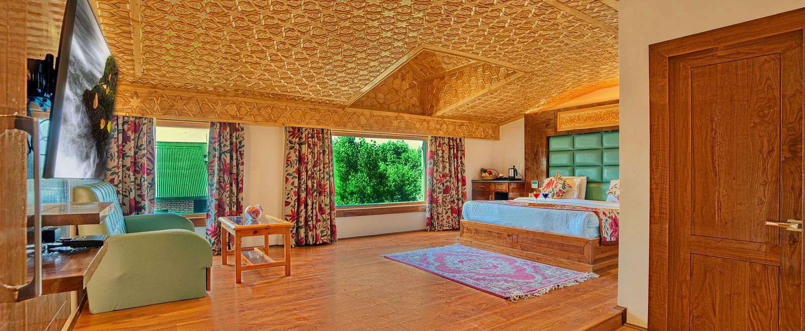 Luxurious room at Royal Comfort Regency with wide open layout and plush furnishings, perfect for extended stays.